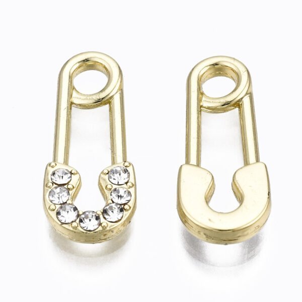 Dije en forma de alfiler dorado con microcircones