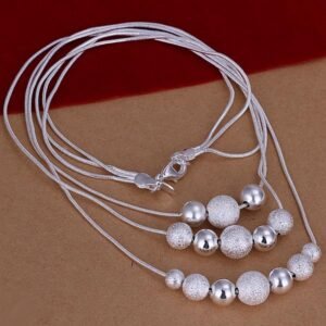 Collar blanco triple bolitas brillantes