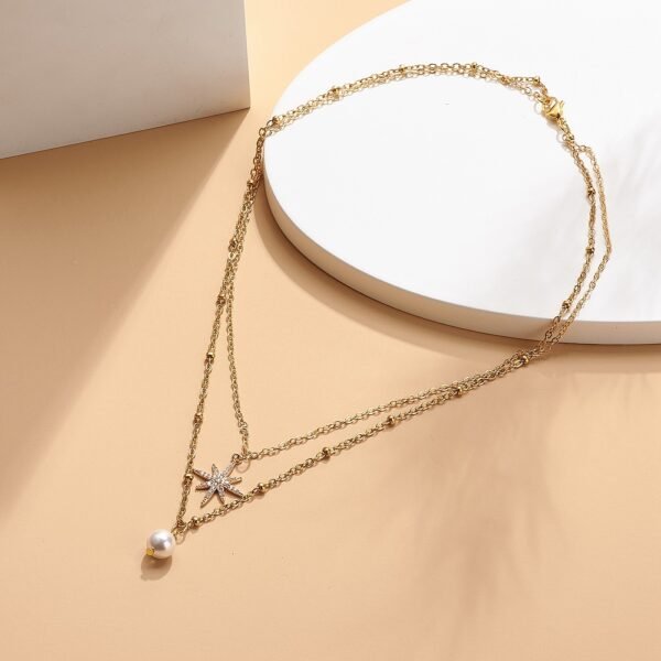 Collar doble de acero dorado modelo layer perla